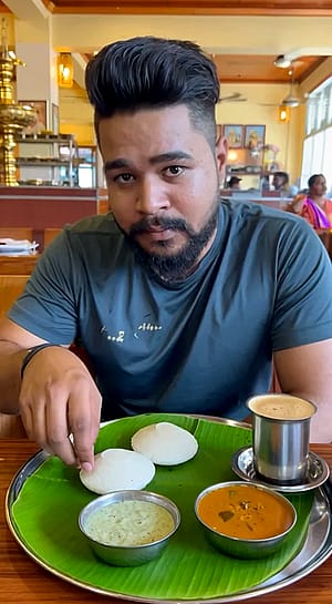 Eating Idli'